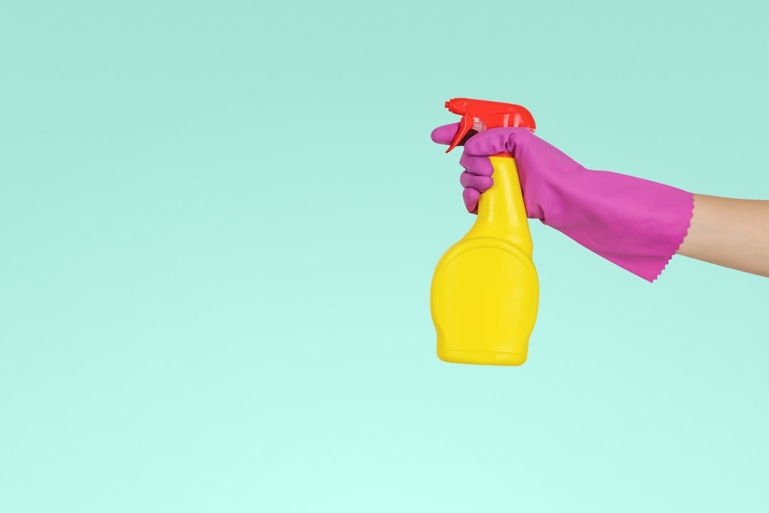 gallery-03 person-holding-yellow-plastic-spray-bottle-zmnefoi3k